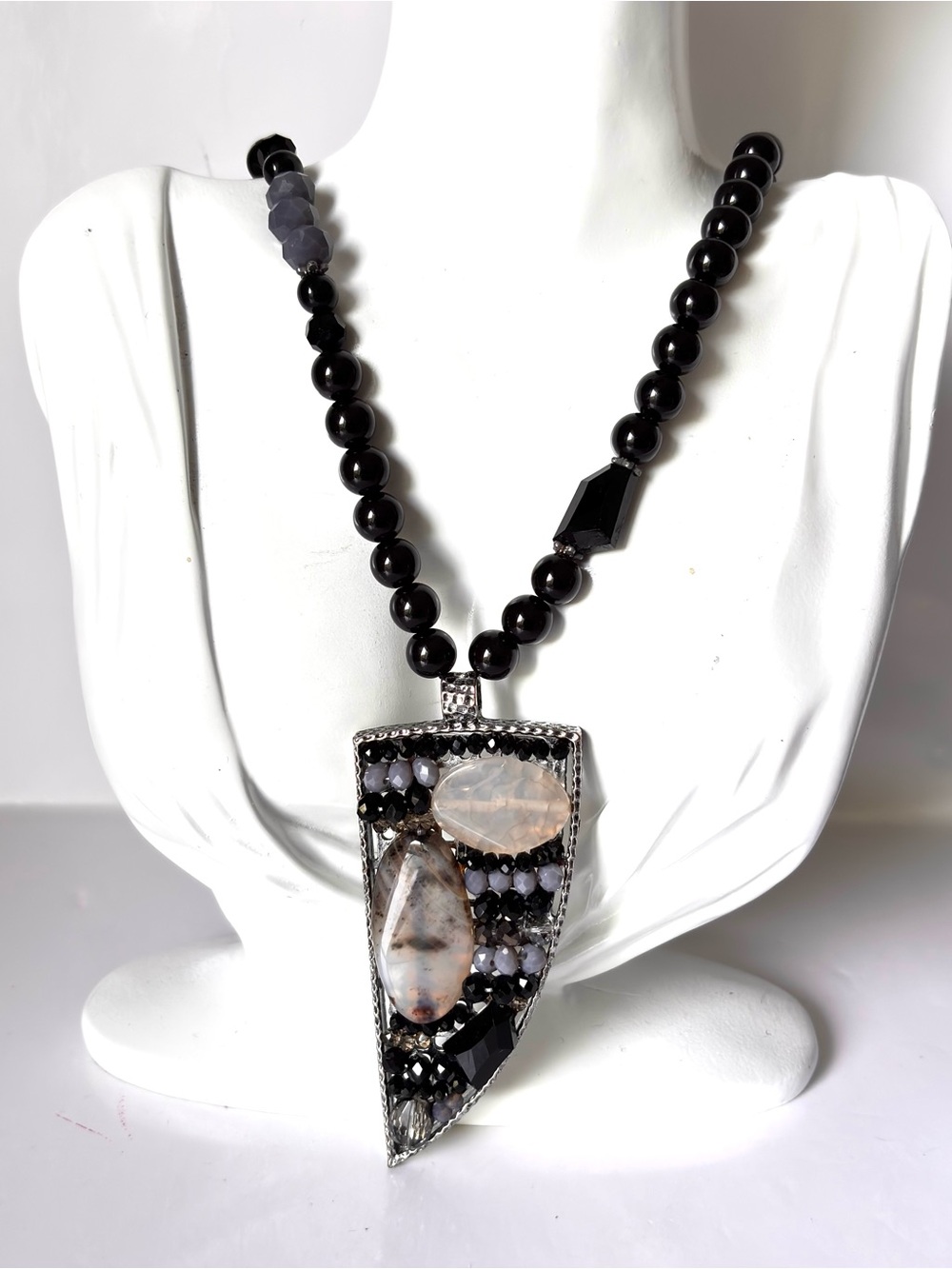 Triangular pendant necklace with black agate stones and translucent Chalcedon